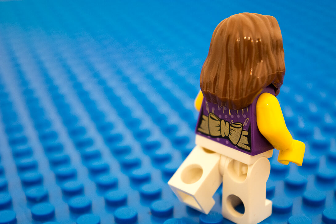 Cyberbullied lego girl running away.